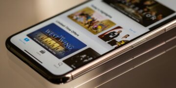 Close-up view of a smartphone featuring a streaming service interface, highlighting technology in modern entertainment.