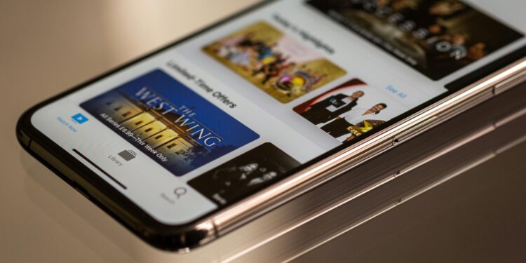 Close-up view of a smartphone featuring a streaming service interface, highlighting technology in modern entertainment.